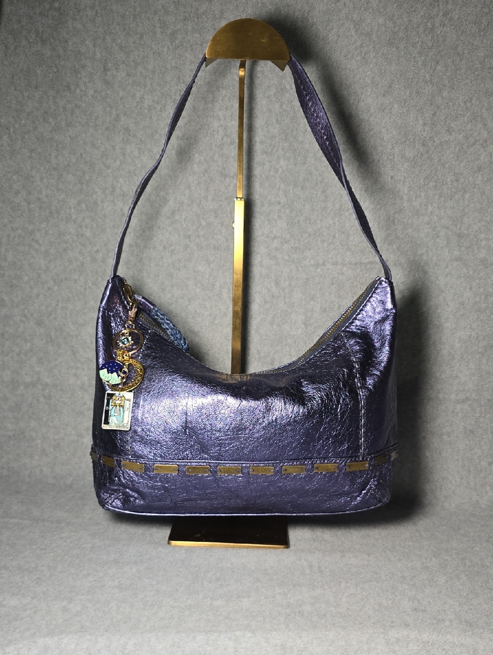 The Sak Bridget Metallic Purple Shoulder Bag with Decorative Charm